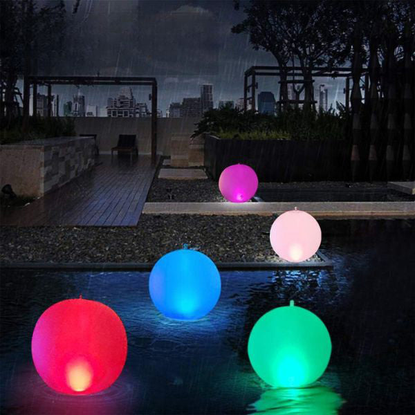 Belro inflatable waterproof pool lamp floating in outdoor pool, providing colorful lighting for home and garden swimming areas.