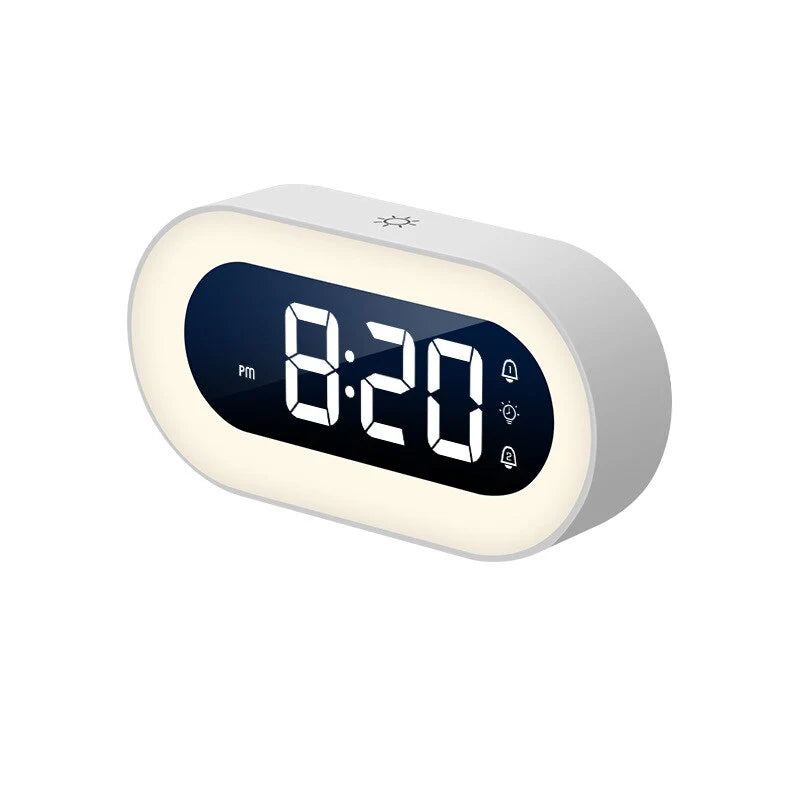 Belro Gentle Light Alarm Clock displaying a soft glow on a bedside table in a cozy bedroom setting