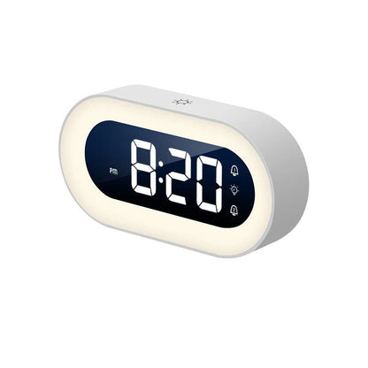 Belro Gentle Light Alarm Clock displaying a soft glow on a bedside table in a cozy bedroom setting