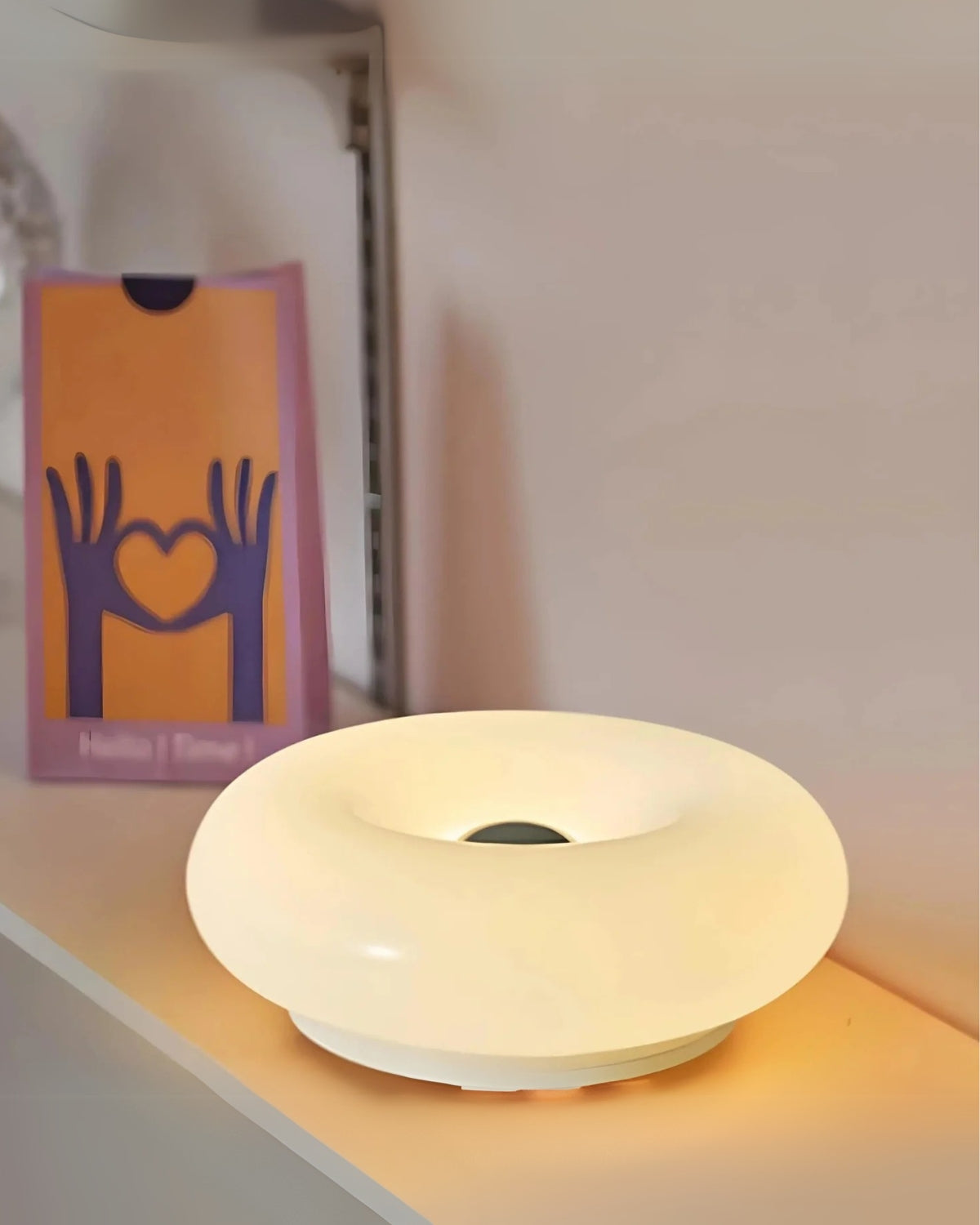 Round donut-shaped Mivoza table lamp with soft LED light, 30cm decorative design for home and garden lighting.
