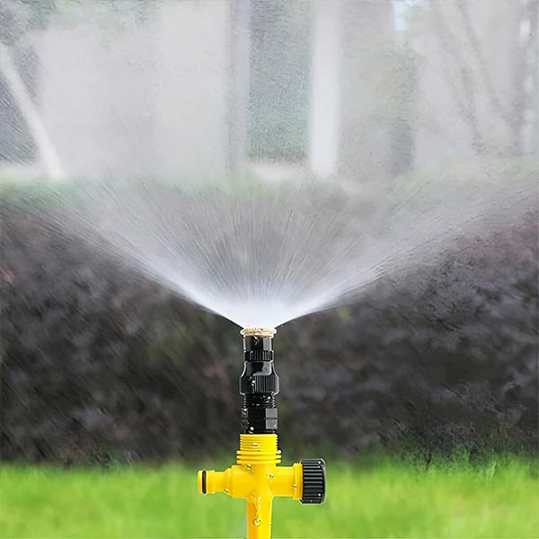 Belro 360 degree garden sprinkler set up outdoors, showing water spray pattern for efficient lawn and garden watering.