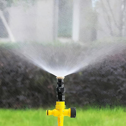 Belro 360 degree garden sprinkler set up outdoors, showing water spray pattern for efficient lawn and garden watering.