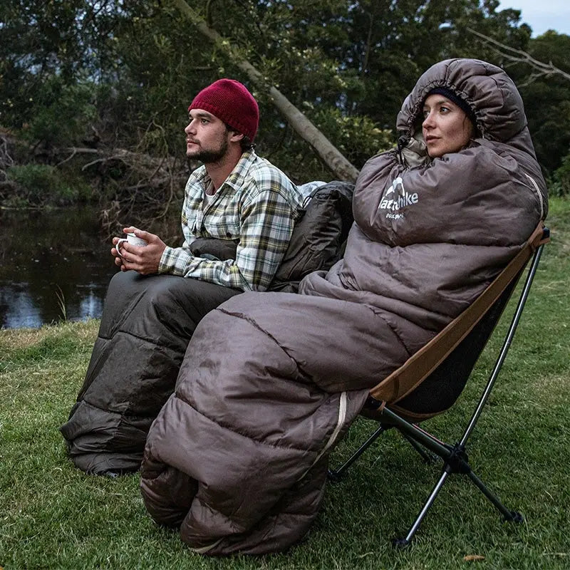 Belro ultra-lightweight outdoor sleeping bag laid out on a camping bed, showcasing its compact design and lightweight material.