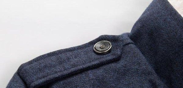 Belro classic wool trench coat hanging on a rack, showcasing its tailored fit, double-breasted design, and neutral color.