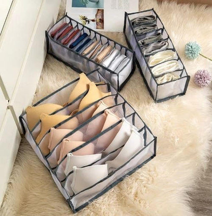 Belro storage boxes for underwear, organized clothing containers for lingerie and undergarments, in clear plastic with compartments.