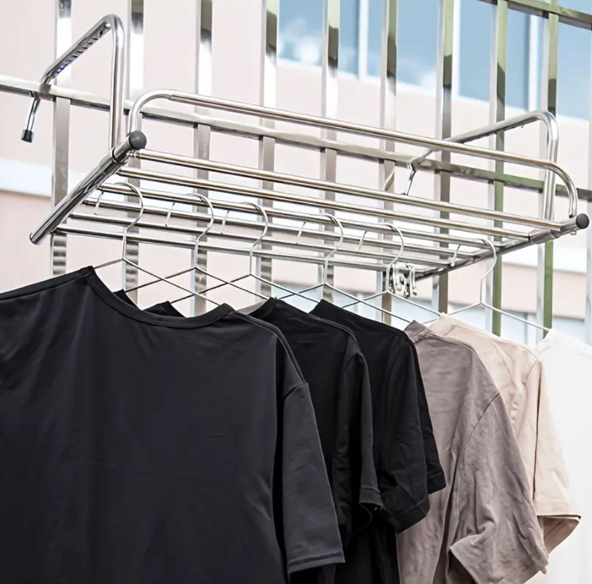 Belro stainless steel extendable foldable balcony clothes dryer with multiple drying bars for outdoor laundry drying.