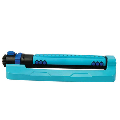 Belro wide range oscillating garden sprinkler system watering a lush lawn outdoors.