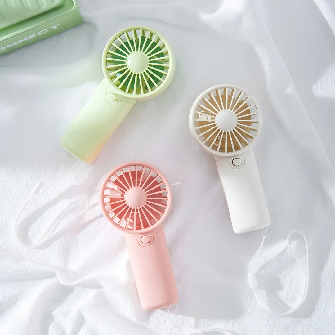 DecorsDeluxe ZenWave Traveler portable mini handheld fan with battery, compact design, perfect for travel and personal cooling.
