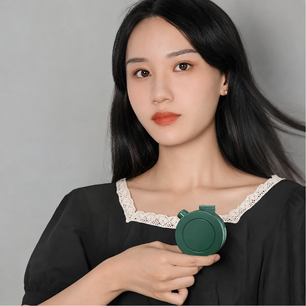 Mini clip-on neck fan by DecorsDeluxe, portable and foldable personal cooling fan with adjustable settings.