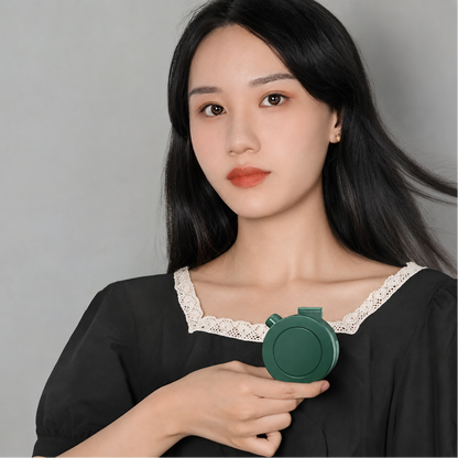 Mini clip-on neck fan by DecorsDeluxe, portable and foldable personal cooling fan with adjustable settings.