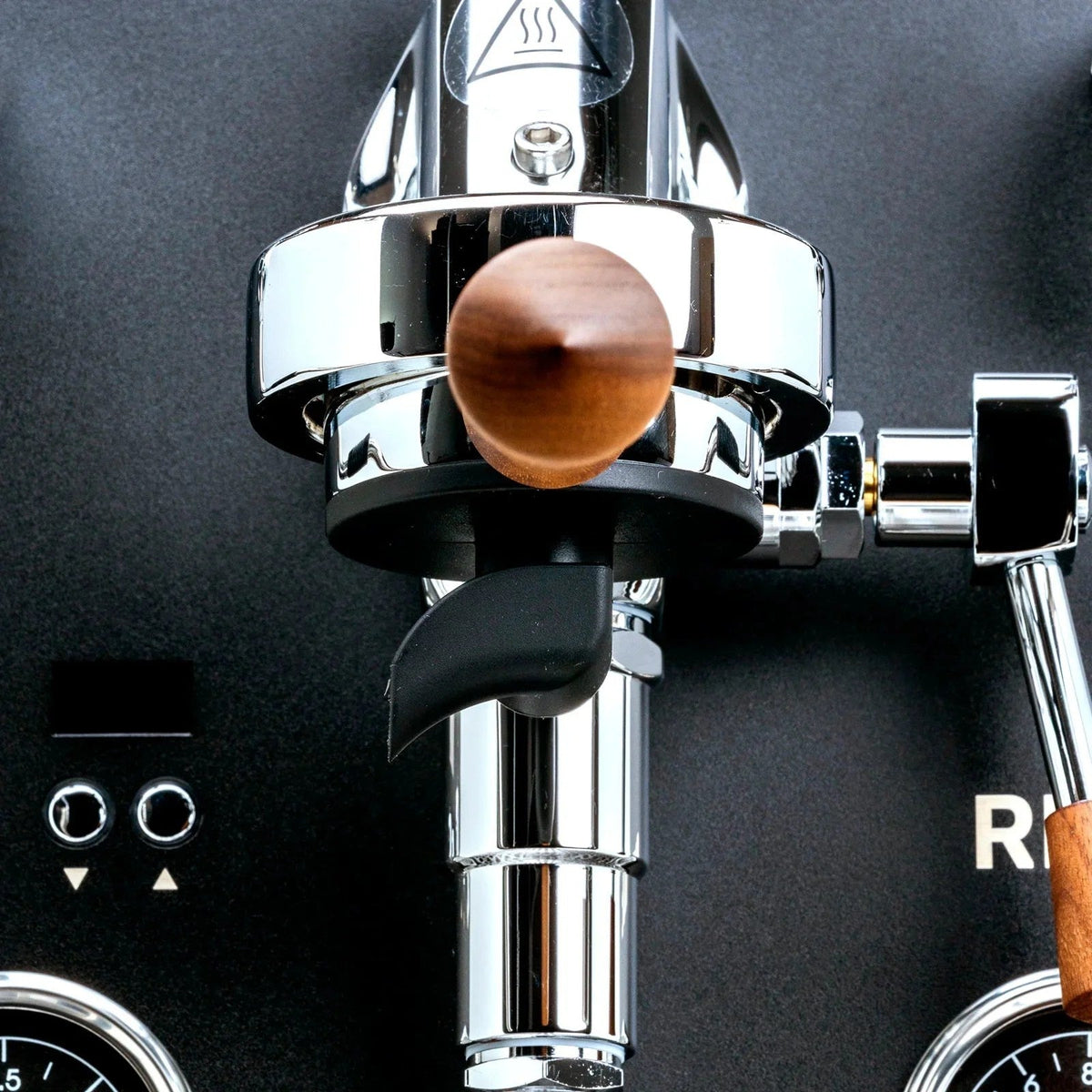 Profitec Ride espresso machine in black walnut finish with detailed view showing sleek design and brewing components.