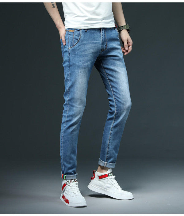 Belro Slim Denim Jeans featuring a classic blue wash and slim fit design, shown on a model against a neutral background.