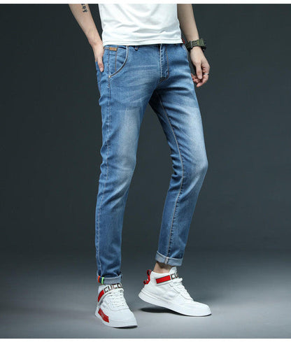 Belro Slim Denim Jeans featuring a classic blue wash and slim fit design, shown on a model against a neutral background.