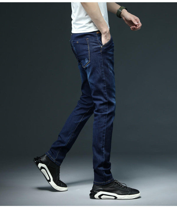 Slim fit denim jeans by Belro, showcasing classic blue color, five-pocket design, and tapered leg style.