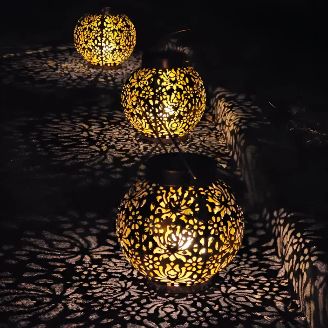 Weatherproof LED solar pendant light by Belro hanging from a garden umbrella, providing outdoor illumination and style.
