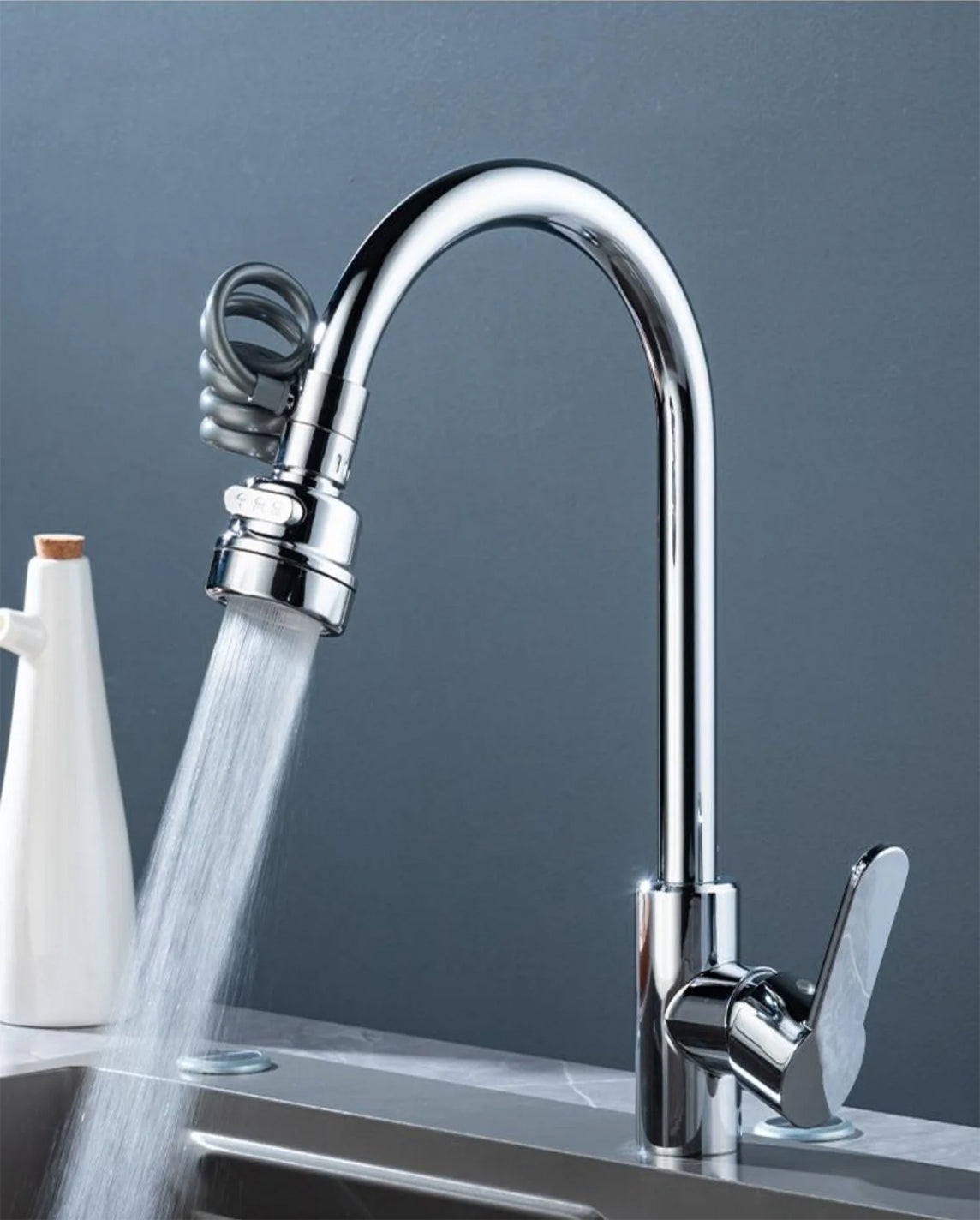 Belro faucet extender tool shown in use, designed to extend and improve reach of bathroom or kitchen faucets.
