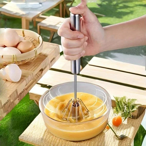 Belro automatic whisk for effortless mixing, shown with stainless steel head and ergonomic handle for kitchen use.