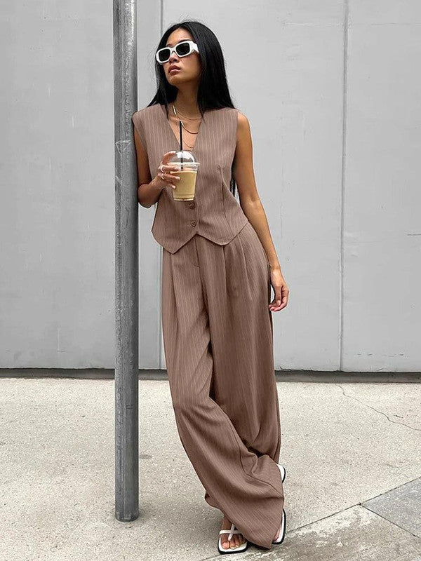 Belro striped pants and vest set for stylish adults, featuring bold vertical stripes in a coordinated clothing ensemble.