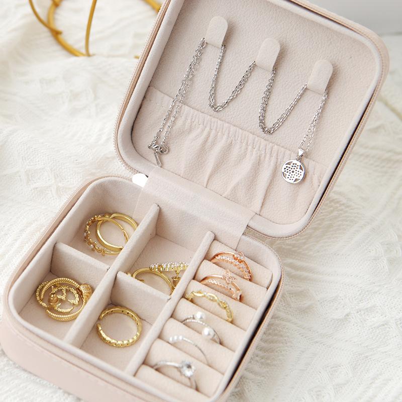 Belro travel jewelry case with compact design, featuring compartments for organizing necklaces, rings, and earrings.