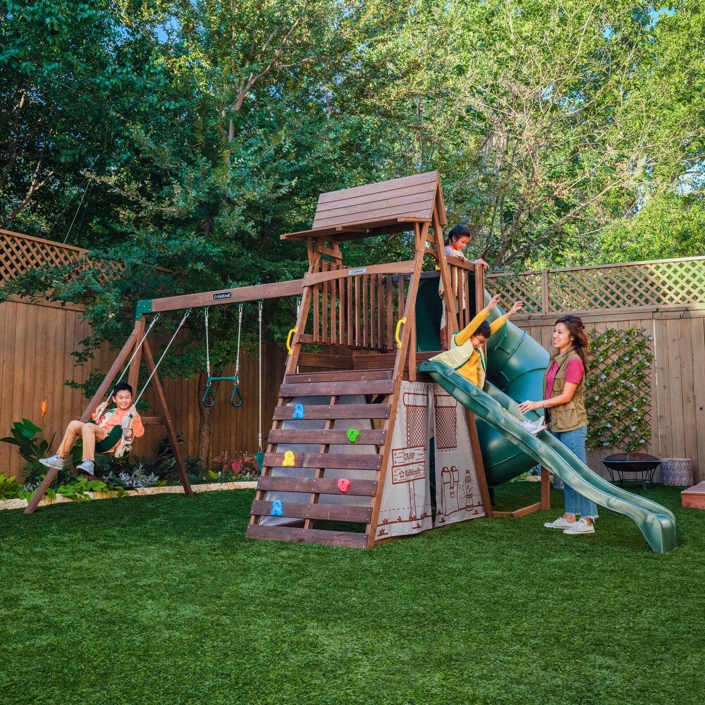 Casavibeo Ranger Retreat Swing Set with multiple swings and slides, outdoor play equipment for kids in a backyard setting.