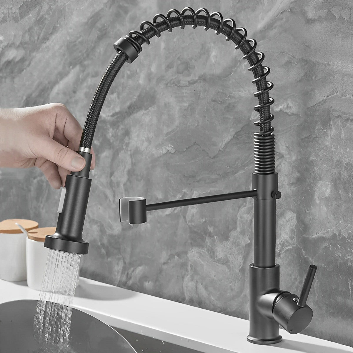 Black single-hole kitchen faucet with pull-down sprayer and 360-degree swivel, ideal for kitchen sink use by Belro.