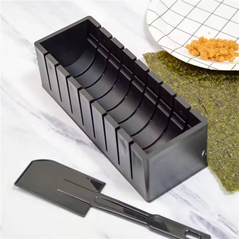 Belro sushi roller for home kitchen, cylindrical device with handle for easy rolling sushi rolls on a countertop.