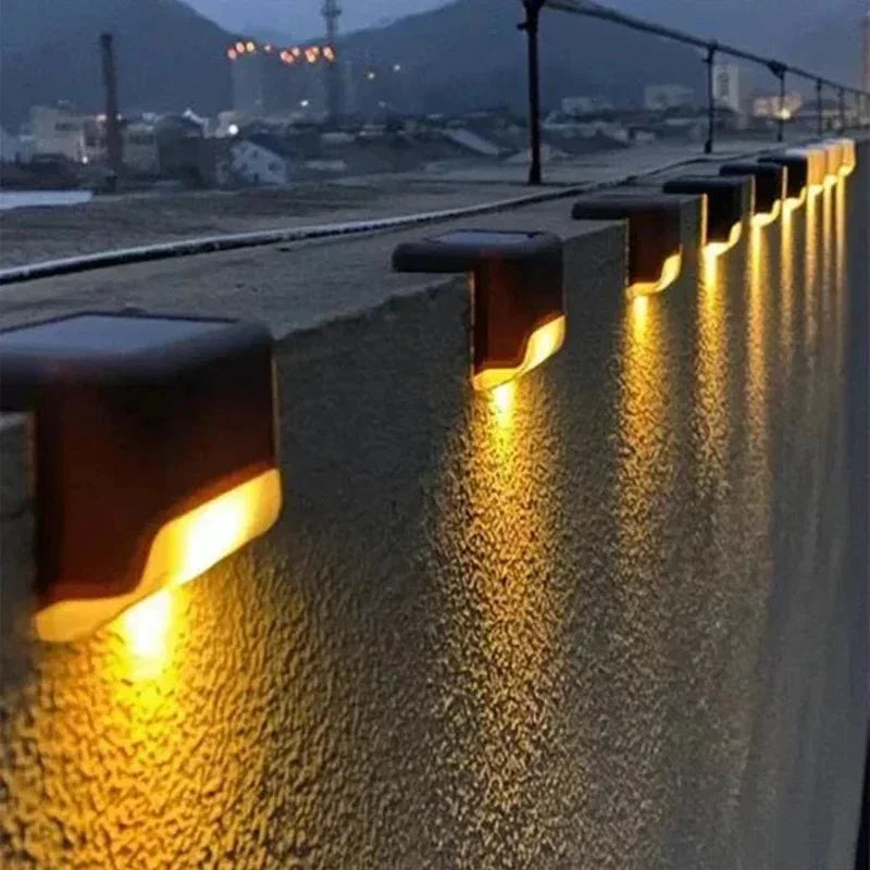 Mivoza solar outdoor step lights in an 8-pack, illuminating garden paths with automatic on/off outdoor step and path lighting.