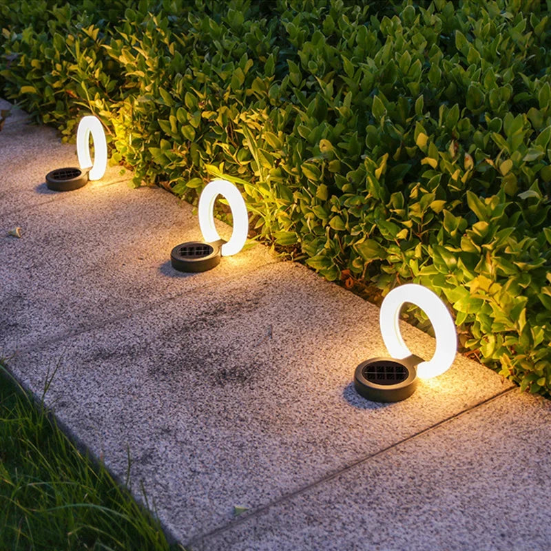 Mivoza solar garden spike light with 360° adjustable head and IP65 weatherproof design, ideal for outdoor ground lighting.