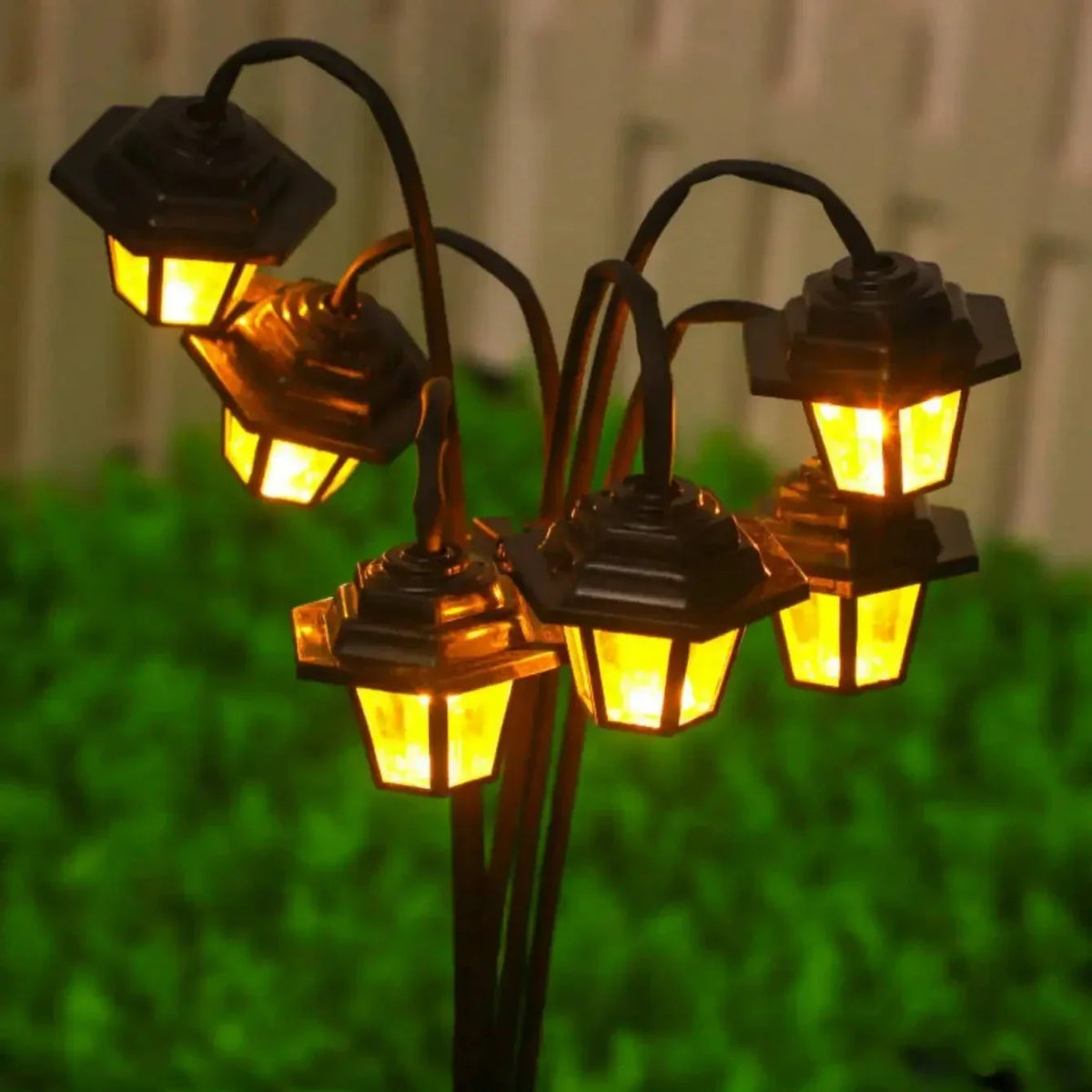 Mivoza Retro Solar Garden Lantern with 6 LED lights, waterproof IP44 outdoor decorative solar garden light in a garden setting.