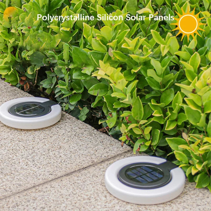 Mivoza solar garden spike light with 360° adjustable head and IP65 weatherproof outdoor ground light in a garden setting