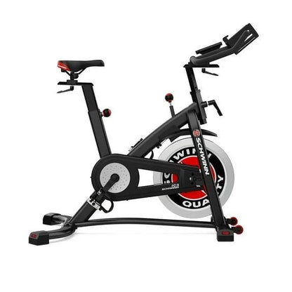 Schwinn Fitness IC3 indoor stationary exercise bike for home use, with adjustable seat and handlebars, in a workout room setting.