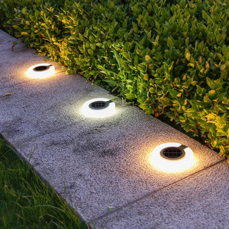Mivoza solar garden spike light with 360° adjustable head and weatherproof IP65 design, ideal for outdoor ground lighting.