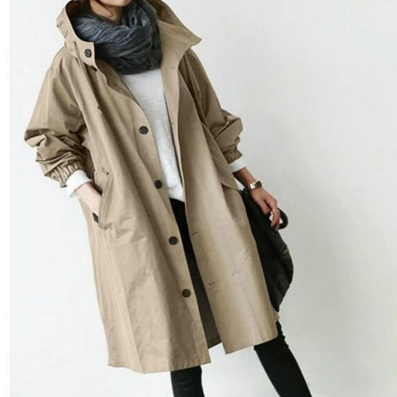 Windproof women's trench coat by BowLift, hooded waterproof outdoor jacket, water-resistant beige trench with storm design.