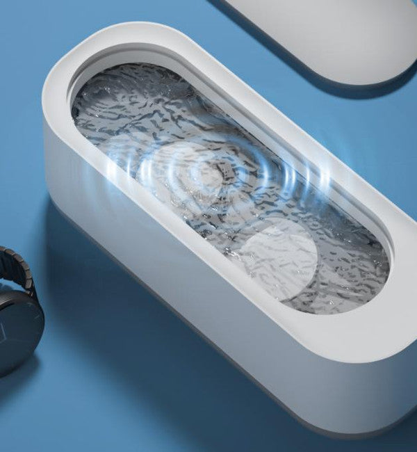 Belro portable ultrasonic jewelry cleaner with a compact design, featuring a stainless steel tank and control panel for easy use.