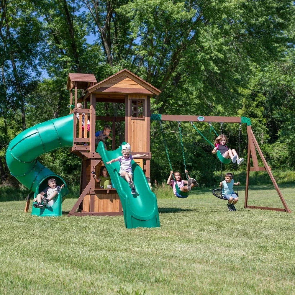 Casavibeo Backyard Discovery Tacoma Falls swing set featuring a wave slide, climbing ladder, and playful outdoor equipment.