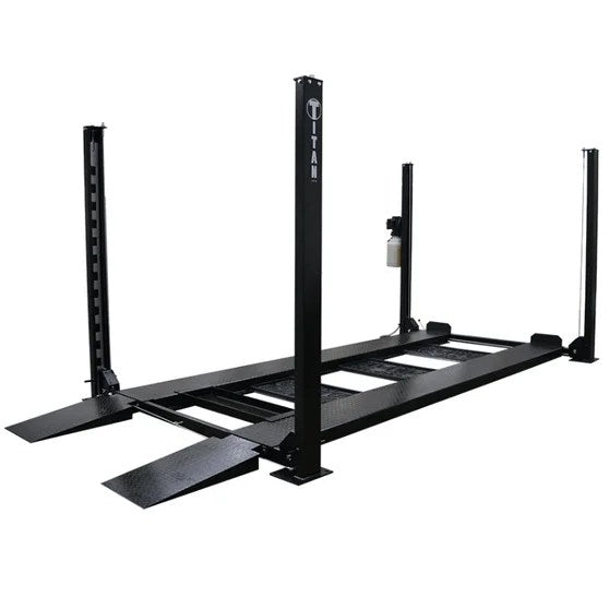 Casavibeo Titan SDPL-8000XLT 4-post lift showing sturdy steel columns and hydraulic arms in a well-lit garage setting.
