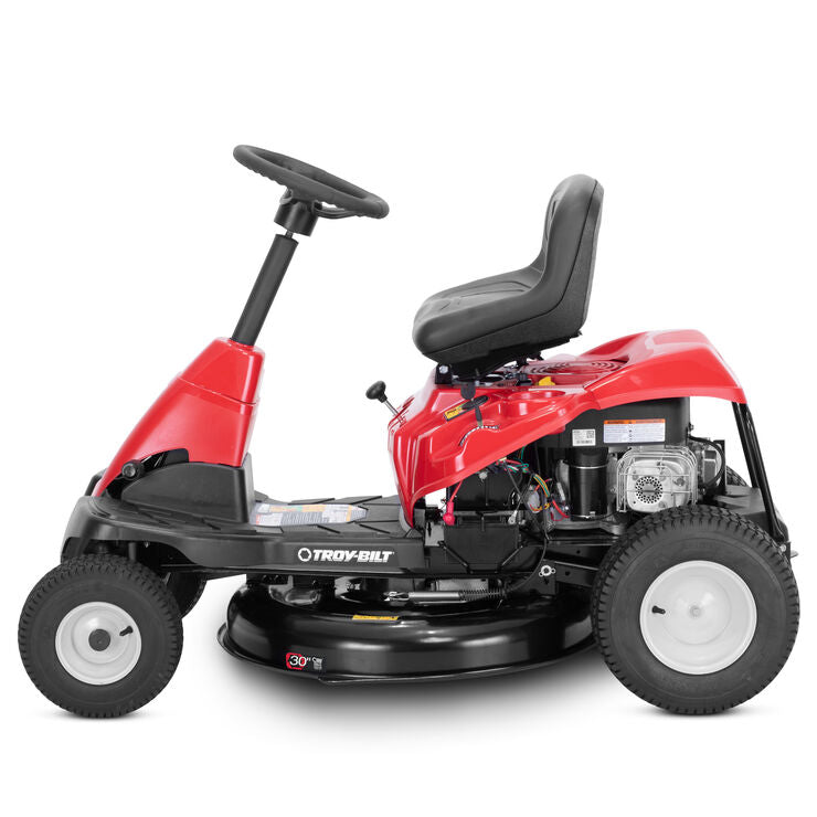 Troy-Bilt TB30B 30-inch riding lawn mower with 10.5 HP Briggs & Stratton engine, shown from the side in a backyard setting.