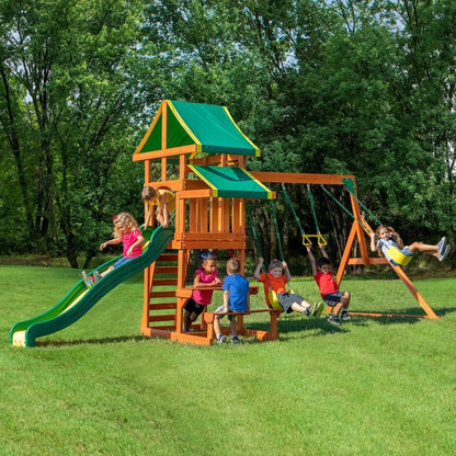 Casavibeo Backyard Discovery Tucson swing set with slides, swings, and climbing features in a backyard setting.