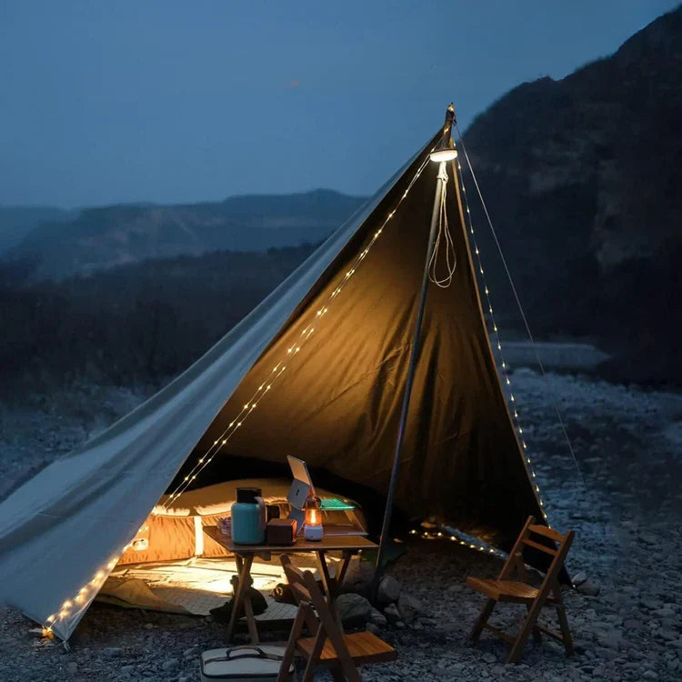 Belro outdoor string light hanging in a garden, featuring warm glowing bulbs for outdoor home and garden decor.