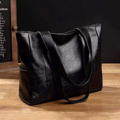 Leather shoulder bag by BowLift with vintage chic style, smooth surface, soft texture, and elegant retro design.