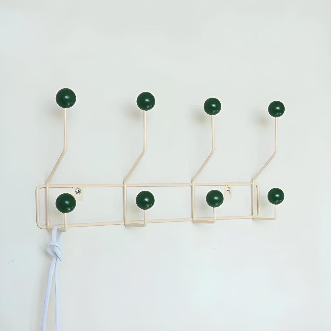 Mid-century wall coat rack by Mivoza with three hooks, vintage style, ideal for hallway or entryway organization.