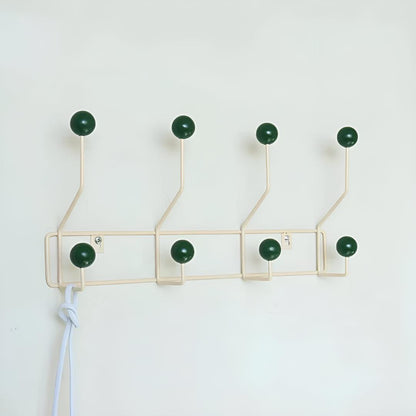 Mid-century wall coat rack by Mivoza with three hooks, vintage style, ideal for hallway or entryway organization.
