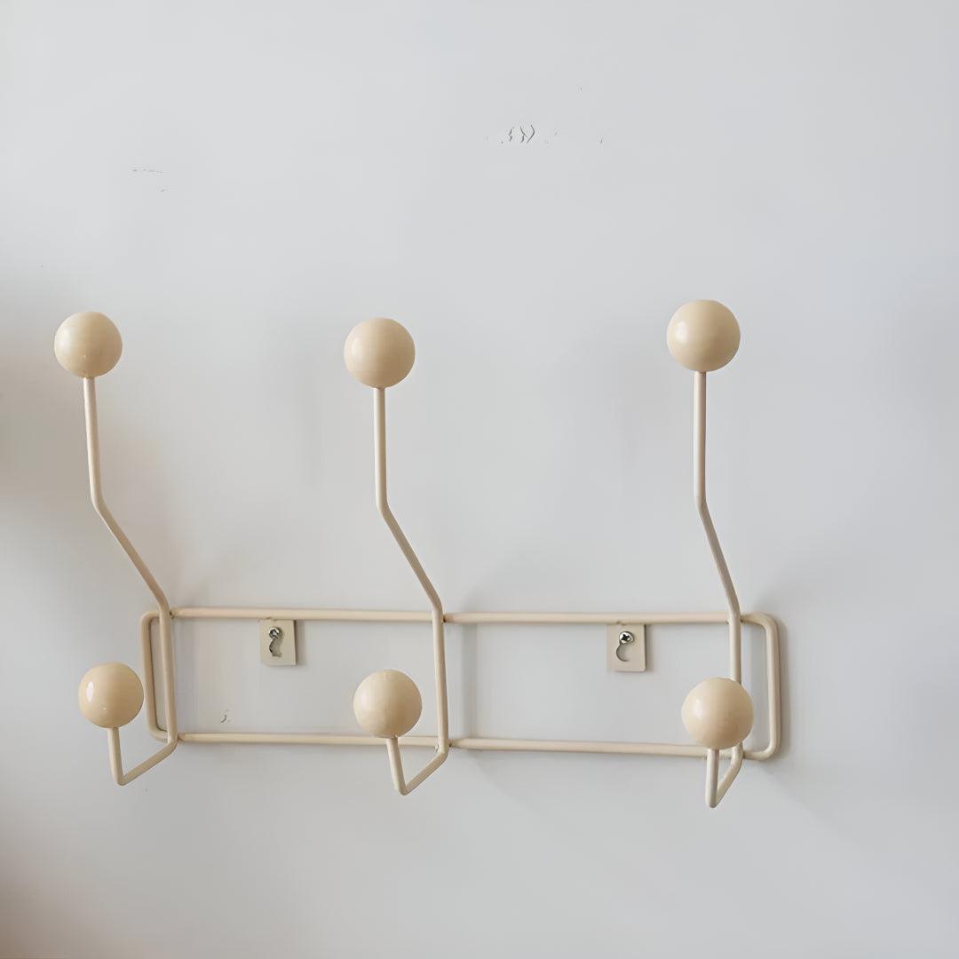 Mid-century wall coat rack with three hooks, stylish hallway organizer by Mivoza, perfect for entryway storage and vintage decor.
