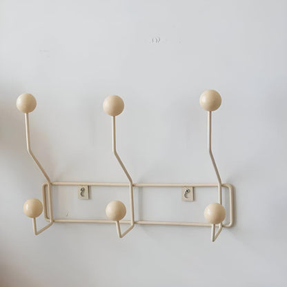 Mid-century wall coat rack with three hooks, stylish hallway organizer by Mivoza, perfect for entryway storage and vintage decor.