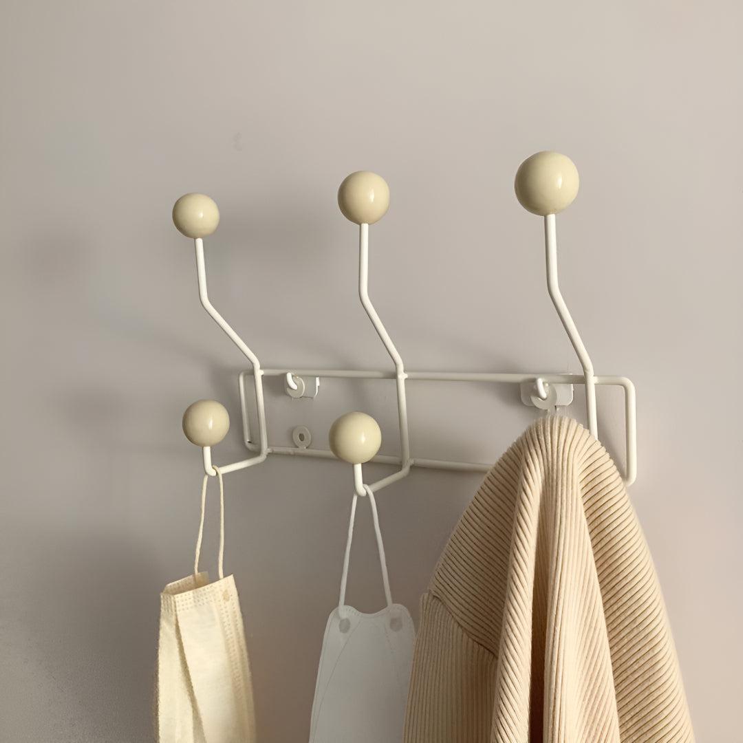 Mid-century wall coat rack with three hooks by Mivoza, vintage style for hallway organization and entryway decor.