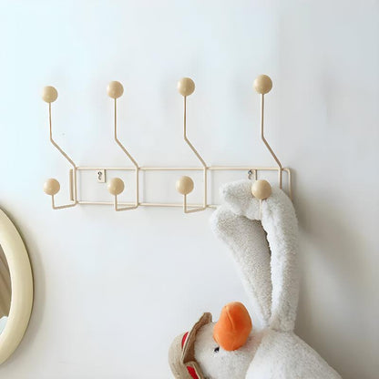 Vintage mid-century wall coat rack with three hooks, stylish hallway organizer in natural wood finish by Mivoza.