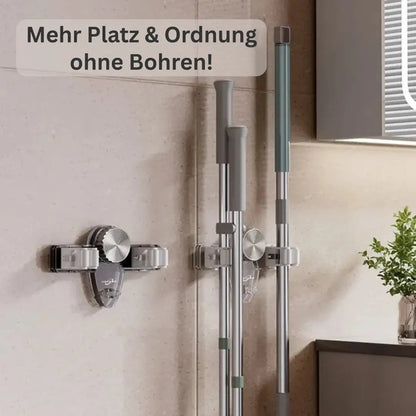 Mivoza wall-mounted broom and mop holder with four hooks, self-adhesive design for space-saving cleaning tool storage.