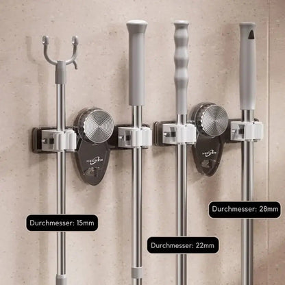 Mivoza space-saving broom and tool wall mount holder with four hook slots, self-adhesive for organized cleaning storage.