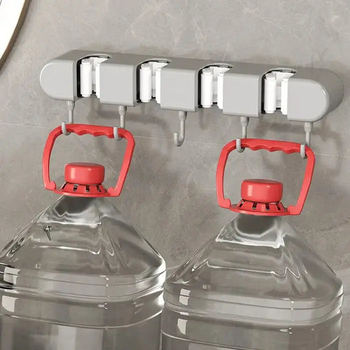 Mivoza wall broom and mop holder for secure, space-saving storage of cleaning tools in home and garden organization.
