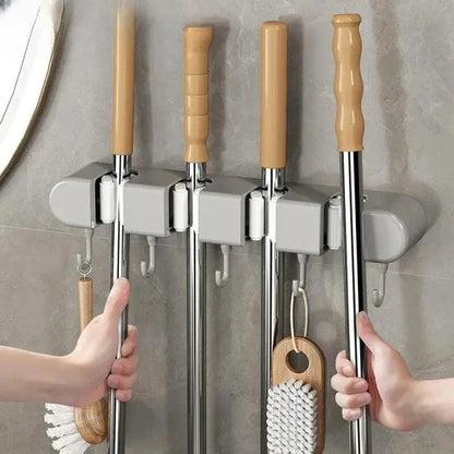 Mivoza wall-mounted broom and mop holder for secure, space-saving storage of cleaning tools in home organization.